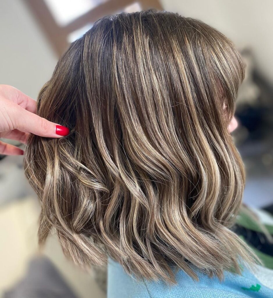 Dimensional brunette bob with face-framing blonde highlights